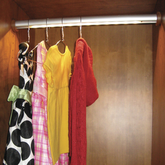 One of our must-try closet design ideas is to use a lighted closet rod.